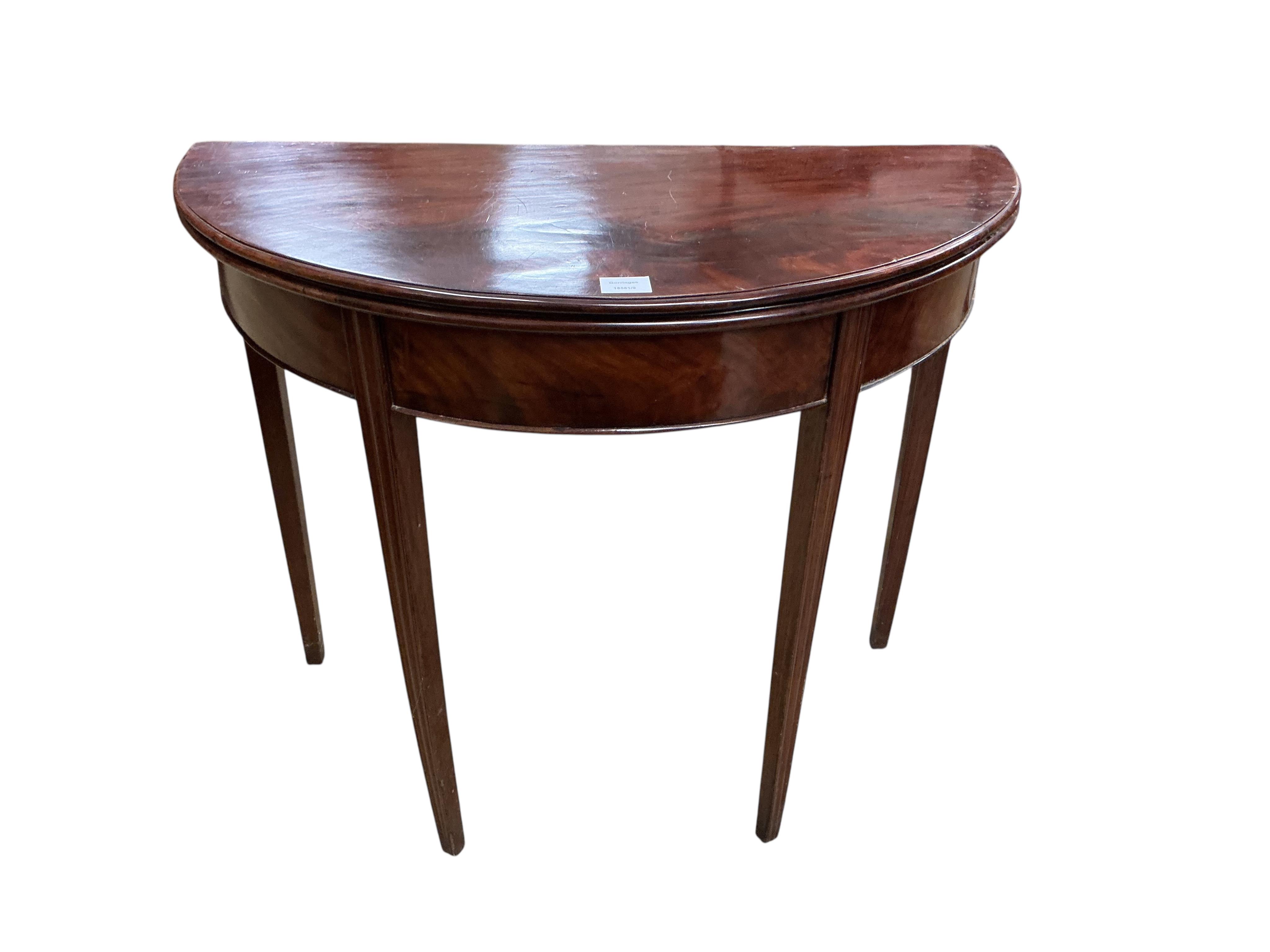 A George III mahogany 'D' shaped folding tea table, width 90cm, depth 44cm, height 72cm